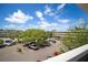 Exterior daytime view of the property showcasing lush trees, blue sky, and ample parking spaces at 2286 Norwegian Dr # 66, Clearwater, FL 33763