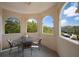 Balcony with table and chairs and three archways looking to outdoor scenery at 2286 Norwegian Dr # 66, Clearwater, FL 33763