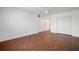 A bedroom with laminate wood flooring and white sliding-door closets at 2286 Norwegian Dr # 66, Clearwater, FL 33763