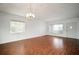 An open living room with laminate flooring, bright lighting and neutral paint at 2286 Norwegian Dr # 66, Clearwater, FL 33763