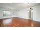 Bright and airy living room featuring laminate floors, chandelier lighting, and neutral walls at 2286 Norwegian Dr # 66, Clearwater, FL 33763