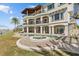 Elegant backyard featuring a custom pool and outdoor patio, designed for luxurious waterfront living at 2402 Baywood W Dr, Dunedin, FL 34698