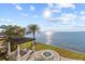 Beautiful backyard featuring waterfront views, a pool, hot tub and pergola at 2402 Baywood W Dr, Dunedin, FL 34698