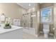 Bright bathroom featuring a shower-tub combo with decorative tiled accents at 2402 Baywood W Dr, Dunedin, FL 34698