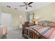 Inviting bedroom with a colorful striped bed and doorway to the adjoining bathroom at 2402 Baywood W Dr, Dunedin, FL 34698