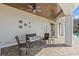 A covered patio with lounge seating and brick flooring at 2402 Baywood W Dr, Dunedin, FL 34698