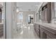 This spa-like main bathroom features a soaking tub, glass-enclosed shower, and designer fixtures at 2402 Baywood W Dr, Dunedin, FL 34698