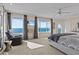 This spacious main bedroom features an ensuite bath, walk-in closet, and breathtaking ocean views at 2402 Baywood W Dr, Dunedin, FL 34698