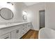 Bathroom features a double vanity, modern mirrors, and sleek design for a luxurious feel at 2444 Jacobs St, Port Charlotte, FL 33953