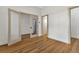 A bedroom with wood floors, neutral walls, and doors to other rooms at 2444 Jacobs St, Port Charlotte, FL 33953