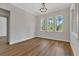 Bright bedroom with beautiful wood floors and a light fixture plus great natural light at 2444 Jacobs St, Port Charlotte, FL 33953
