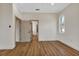 Bedroom boasts wood floors, open doors, and natural light, creating an inviting and airy ambiance at 2444 Jacobs St, Port Charlotte, FL 33953