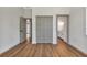 Spacious bedroom featuring wood floors, multiple doorways, and a large closet at 2444 Jacobs St, Port Charlotte, FL 33953