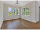 Light-filled breakfast nook with large windows overlooking a green space at 2444 Jacobs St, Port Charlotte, FL 33953