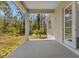 Spacious covered patio with backyard view of sunny landscaping and trees at 2444 Jacobs St, Port Charlotte, FL 33953