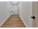 Hallway with wood flooring leading to laundry room with cabinet and appliances hook ups at 2444 Jacobs St, Port Charlotte, FL 33953