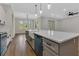Kitchen island with farmhouse sink and view into the light-filled breakfast nook at 2444 Jacobs St, Port Charlotte, FL 33953