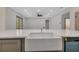 Bright kitchen features a farmhouse sink and quartz countertops at 2444 Jacobs St, Port Charlotte, FL 33953