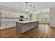 Bright, open kitchen features white cabinets, stainless appliances, and a large island at 2444 Jacobs St, Port Charlotte, FL 33953