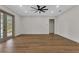 Open-concept living room featuring lots of natural light and a ceiling fan at 2444 Jacobs St, Port Charlotte, FL 33953