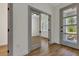 An open office with wood floors and a door leading to a porch at 2444 Jacobs St, Port Charlotte, FL 33953