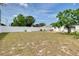 Spacious backyard with patio and white fence, perfect for outdoor activities at 2605 Fulton Sw St, Largo, FL 33774