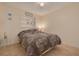 Cozy bedroom with tiled floors and nautical-themed decor on a decorative shelf at 2605 Fulton Sw St, Largo, FL 33774