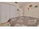 Comfortable bedroom featuring tiled floors and a large closet at 2605 Fulton Sw St, Largo, FL 33774