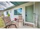 Inviting front porch with comfortable seating, decorative accents, and a welcoming entrance at 2605 Fulton Sw St, Largo, FL 33774