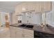 Kitchen features wood cabinets and stainless steel sink at 2605 Fulton Sw St, Largo, FL 33774