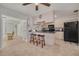 Bright kitchen with bar seating, light cabinets, and modern appliances at 2605 Fulton Sw St, Largo, FL 33774