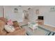 Comfortable living room featuring tile floors and a casual seating arrangement at 2605 Fulton Sw St, Largo, FL 33774