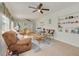 Bright living room with tile flooring, ceiling fans, and comfortable seating at 2605 Fulton Sw St, Largo, FL 33774