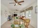 Living room features multiple ceiling fans and large windows at 2605 Fulton Sw St, Largo, FL 33774