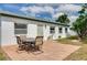 Outdoor patio with seating area, ideal for enjoying outdoor living at 2605 Fulton Sw St, Largo, FL 33774