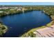 Aerial view of the lakefront property, showcasing the home's proximity to the water at 2782 Countryside Blvd # 2, Clearwater, FL 33761