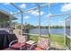 Enjoy outdoor living on this cozy screened-in back patio with lake views at 2782 Countryside Blvd # 2, Clearwater, FL 33761