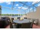 Enjoy outdoor living on this spacious screened-in back patio with lake views at 2782 Countryside Blvd # 2, Clearwater, FL 33761