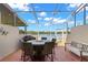 Enjoy outdoor living on this cozy screened-in back patio with lake views at 2782 Countryside Blvd # 2, Clearwater, FL 33761