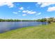Expansive lush green backyard with stunning lake views at 2782 Countryside Blvd # 2, Clearwater, FL 33761