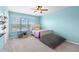 Bedroom with serene lake views, neutral carpet, and stylish furnishings at 2782 Countryside Blvd # 2, Clearwater, FL 33761