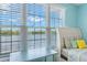 Bright bedroom showcasing large windows with stunning lake views at 2782 Countryside Blvd # 2, Clearwater, FL 33761