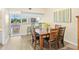 Charming dining area with views and a four-chair wood table at 2782 Countryside Blvd # 2, Clearwater, FL 33761
