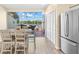 Bright eat-in kitchen with stainless appliances, backyard access, and lake views at 2782 Countryside Blvd # 2, Clearwater, FL 33761