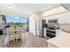 Kitchen and dining area flow out to the beautiful lanai and lake at 2782 Countryside Blvd # 2, Clearwater, FL 33761