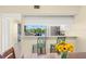 Kitchen bar overlooking the lanai and lake at 2782 Countryside Blvd # 2, Clearwater, FL 33761