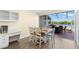 Bright kitchen and dining area with wood flooring and backyard access at 2782 Countryside Blvd # 2, Clearwater, FL 33761