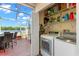 Laundry room with lake view access to screened-in patio at 2782 Countryside Blvd # 2, Clearwater, FL 33761