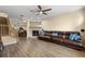Comfortable living room with wood floors, fireplace and a large leather sofa at 2782 Countryside Blvd # 2, Clearwater, FL 33761