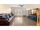 A bright living room with a bay window, wood-look floors and comfortable seating at 2782 Countryside Blvd # 2, Clearwater, FL 33761